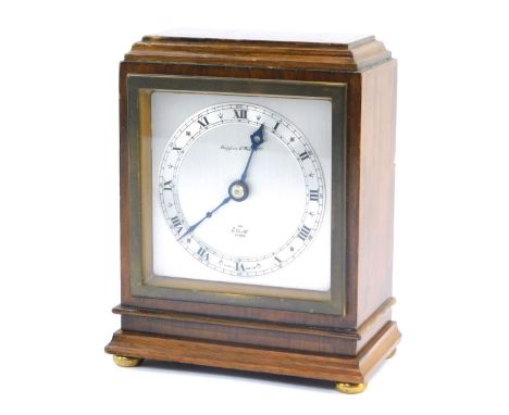 An Elliot mahogany cased mantel clock for Mappin &amp; Webb Limited, square silvered dial with chapter ring bearing Roman num