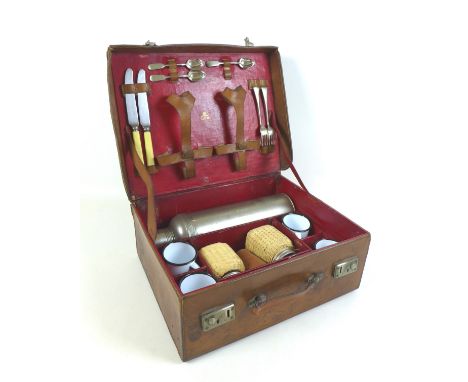 An early 1900s tan leather picnic/motoring travel case by J. S. Vickery London, with a fitted interior containing thermos, en