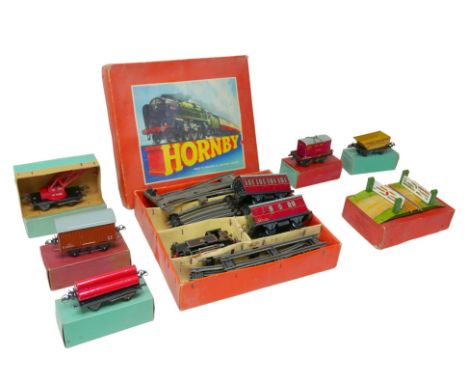 A group of vintage Hornby O gauge railway models, including a clockwork passenger set no. 41 (with loco, tender and one carri