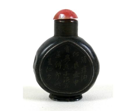 A 19th century Chinese snuff bottle, metal and black enamel, ovoid form with two inscribed panels front and back in Chinese c