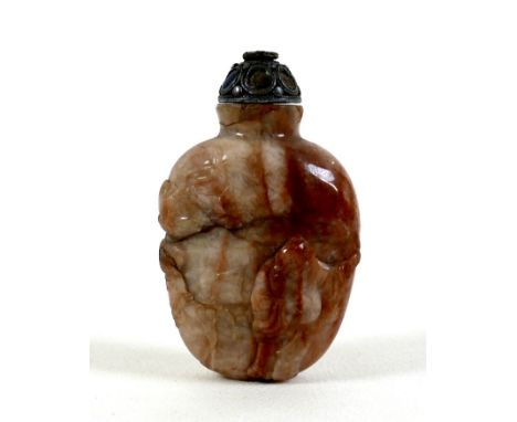 A 19th century Chinese snuff bottle, red and cream variegated hardstone, ovoid form carved with a figure, lantern, and a cran