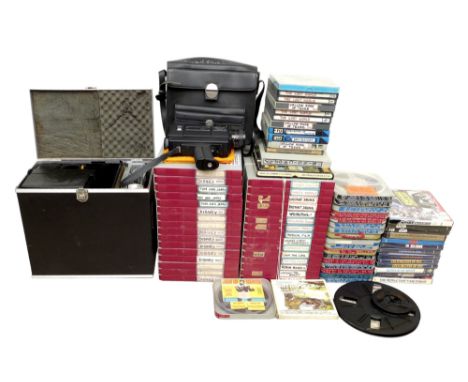 A Super 8 projector and camera with collection of film reels, including Star Wars, boxing matches featuring Muhammed Ali and 