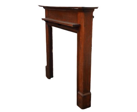 An oak fire surround, 142 by 21 by 127 cm high, with a inner measurements of 95 by 97.5 cm high. 