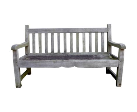 A garden bench, well weathered, with slatted back, 152 by 60 by 89.5cm. 