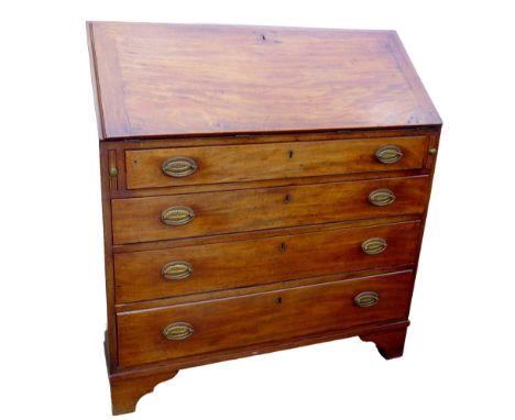A Georgian mahogany bureau, with fall front revealing fitted interior, over four long drawers, with brass oval plate handles,