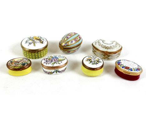 A group of seven enamel and china pill boxes, four by Bilston and Battersea Enamels, two Limoges, and one Staffordshire Ename