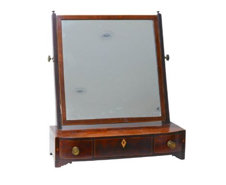 A Regency mahogany toilet mirror, raised upon bracket feet, 55 by 31 by 62cm high. Repair to feet.