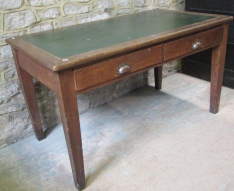 A vintage oak office table of rectangular form, with faux leather inset top over two frieze drawers, raised on square tapered