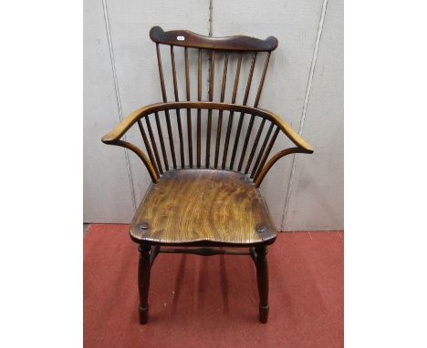 Early Georgian Windsor stick back elbow chair in mixed woods with dished elm seat, turned supports and rails 