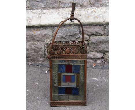 A Victorian hall or porch lantern of square form with leaded light panels an pierced detail 