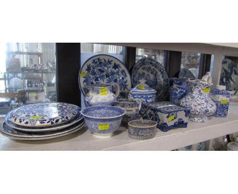 A collection of 19th century and later blue and white printed wares including a jug with shepherd playing his pipe and other 