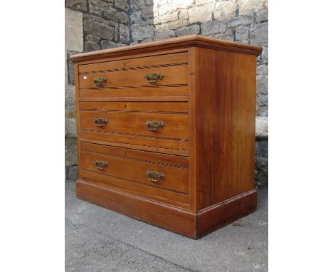 An Edwardian satin walnut bedroom chest of three long drawers set on a moulded plinth, 3ft wide appox together with a small t