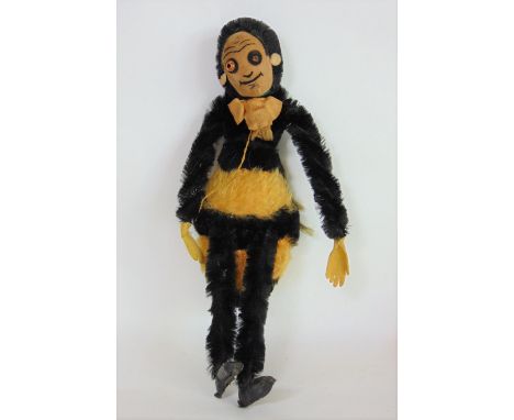 1930's toy bumble bee by Chad Valley with fur body, velvet face (1 eye missing), wired legs, pin on reverse reads 'Chad Valle