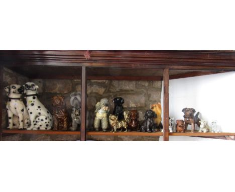 A collection of various ceramic and other dogs including a pair of large Dalmatians, Poodle, Black Labrador, Bull Dog, etc (1