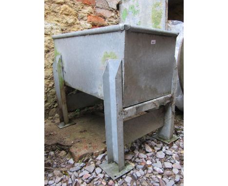 A galvanised trough/planter of rectangular form with rounded edge, raised on removable supports. 125 cm long x 50 cm wide x 4