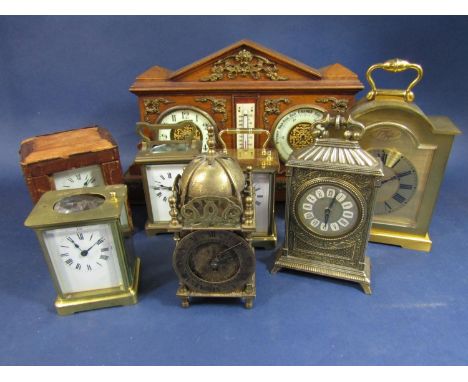 A mixed collection of clocks to include four carriage clocks, a reproduction lantern type clock, two further brass examples a