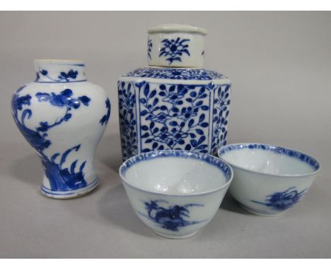 A collection of oriental blue and white ceramics including a 19th century caddy  and cover of square shaped form with canted 