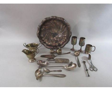 A mixed collection of continental white metal and silver plate comprising a scalloped dish upon three ball feet, various flat