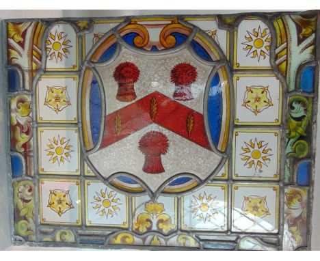 four 19th century or earlier leaded light panels all with armorial detail including a royal coat of arms, all framed within r