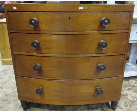 A 19th century bow front caddy top bedroom chest of four long graduated drawers raised on turned supports, 92 cm wide(af) 