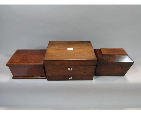 19th century rosewood dressing box, the hinged lid enclosing various lidded jars and manicure tools, 28cm wide, together with