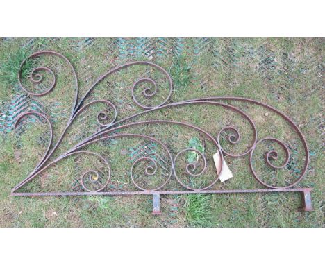 An ornamental iron work bracket with decorative scroll work detail, 120 cm x 70 cm approximately 