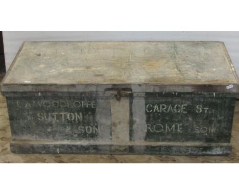An old painted pine tool chest with hinged lid containing a collection of vintage carpentry tools and a Victorian mahogany la