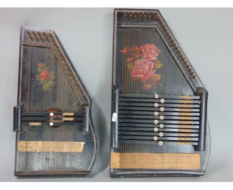 A mixed lot comprising two auto harps, a collection of Thunderbirds Christmas crackers, a letterbox, three train mantle clock