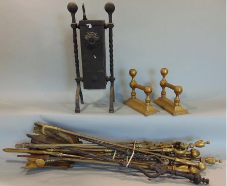 Large collection of mainly brass fire tools together with a pair of brass fire dogs, etc 