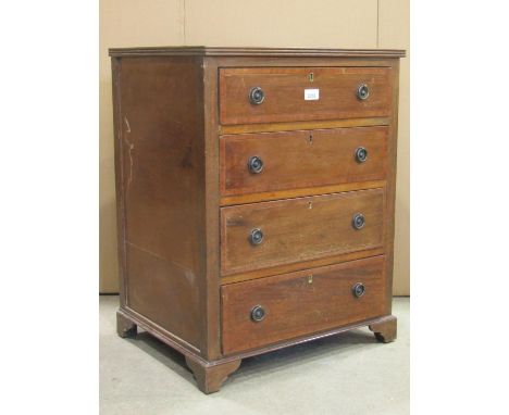 A small Edwardian chest of four long drawers with satinwood crossbanding and bracket feet, 55 cm wide x 72 cm in height 