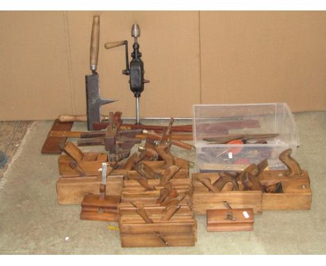 A collection of vintage carpentry tools mainly a variety of planes, square gauges, etc 