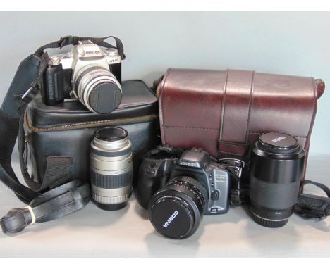 A Pentax MZ-50 and Minolta Dynax 500SI Super both with two lenses in camera bags, together with ane box of photographic acces