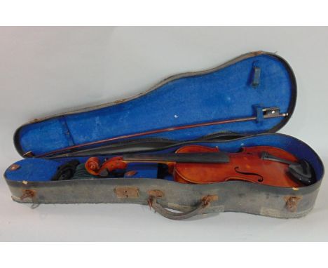 A Czechoslovakian three quarter length violin, the label inscribed 'Anioniua Stradivarius Cremonensis', within a leather case