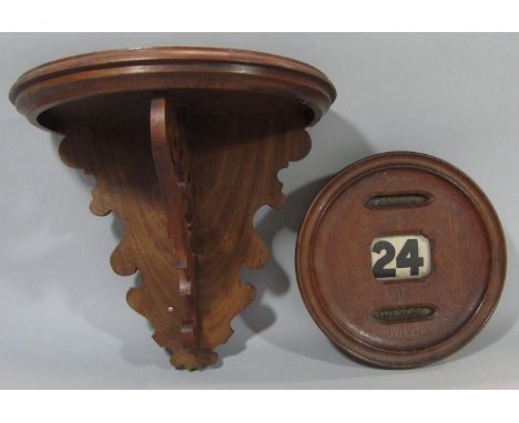 Vintage oak circular wall perpetual date calendar, 24 cm diameter together with a further fruitwood wall bracket with scrolle