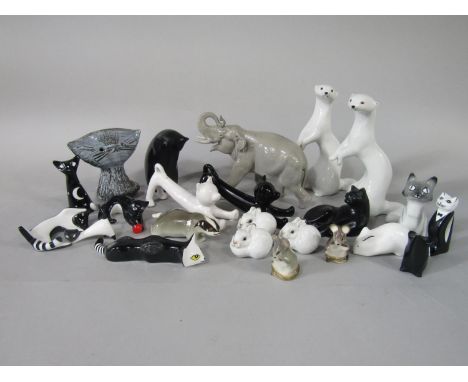 A collection of USSR ceramic animals including a running elephant, a pair of white stoats, two rabbits, etc, together with a 