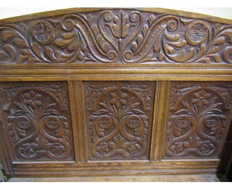 A Victorian oak hall bench or settle, the box base flanked by scrolled arms the raised back with further panels and set benea
