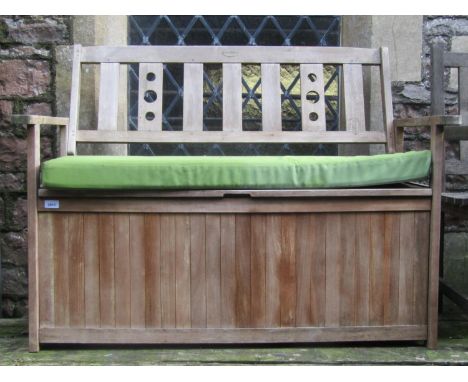 A Green Fingers contemporary teak two seat garden bench with partially pierced slatted back over a hinged box seat with loose