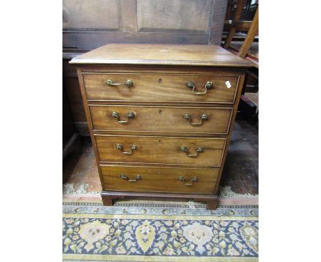 A small Georgian mahogany chest of four long graduated drawers, with brass swan neck handles, raised on bracket support, 62cm