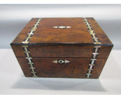 19th century burr walnut and mother of pearl inlaid dressing box, the hinged lid enclosing a fitted interior with various whi