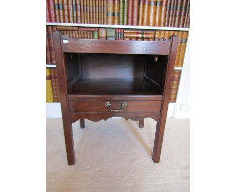 A mahogany tray top commode in the Georgian manner, with open centre over a single frieze drawer, raised on square moulded su