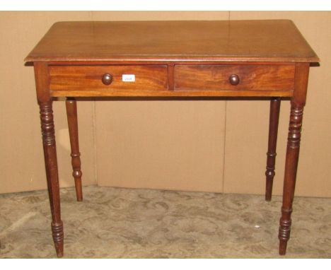 A 19th century mahogany side table fitted with two frieze drawers raised on ring turned and tapered legs, together with a Vic