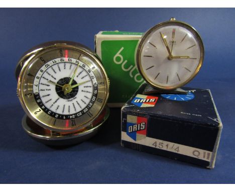 Unusual cased Bulova travel world time clock, with a further Oris seven jewel alarm clock (2) 