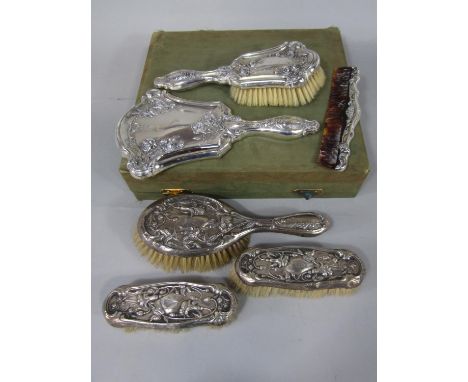 Edwardian three piece dressing set comprising three brushes embossed with scrolled fuchsias, maker Samuel M Levi; together wi