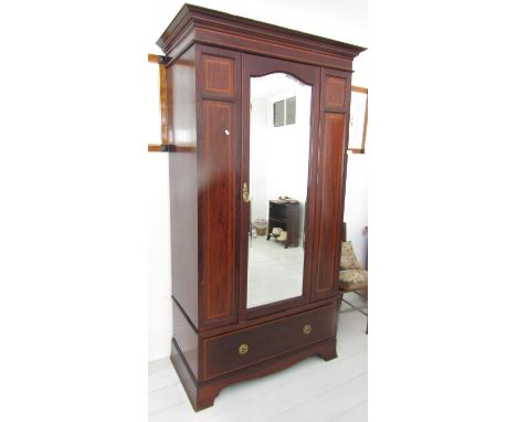 A good quality inlaid Edwardian mahogany single wardrobe with satinwood crossbanded detail, stepped and moulded cornice over 