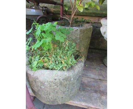 A weathered natural stone trough/planter of circular form 38 cm in diameter x 24 cm in height, together with a further weathe