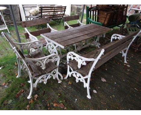 A good quality five piece garden suite in the Coalbrookdale manner, comprising rectangular table, bench and three armchairs, 