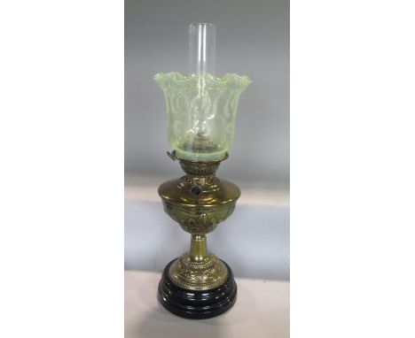 A good late 19th century brass oil lamp, with two vaseline shades, 46cm high including shades 