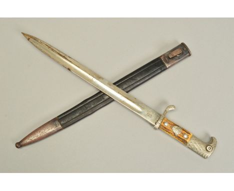 A WWII ERA 3RD REICH GERMAN MUNICIPAL POLICE BAYONET AND METAL AND LEATHER SCABBARD, the bayonet has the large Eagle head top