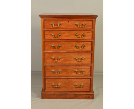 A MID VICTORIAN WALNUT CHEST OF SIX GRADUATED LONG DRAWERS, moulded rectangular top, Gothic style brass handles, locks marked