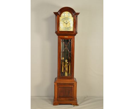 AN EARLY 20TH CENTURY MAHOGANY LONGCASE CLOCK, with tubular quarter chiming mechanism, the arched hood with pierced sound boa